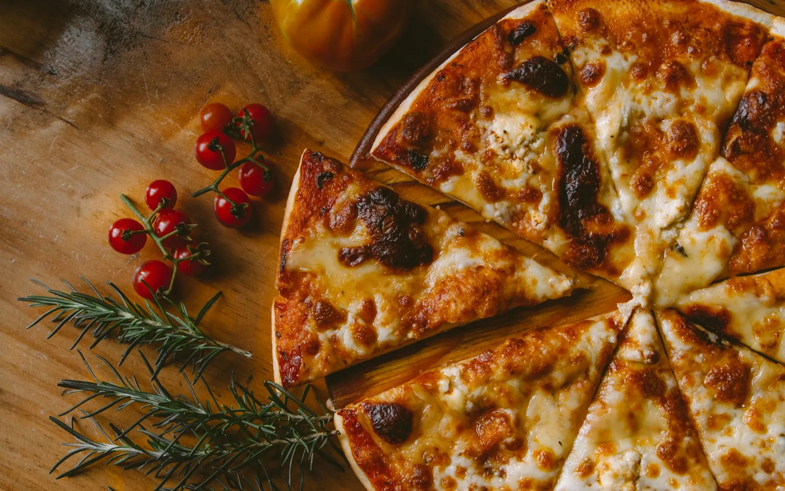 A homemade pizza with bubbling cheese and browned crust
