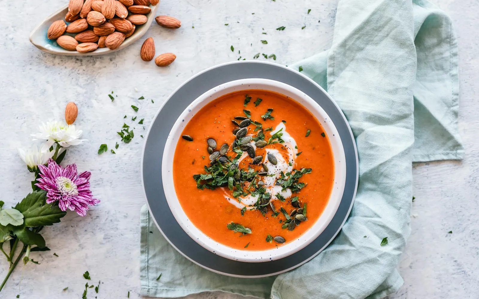 A bowl of chilled soup with herbs